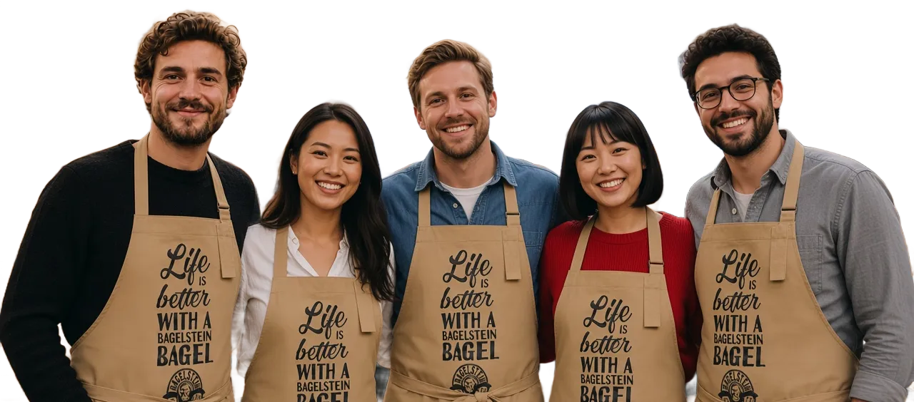 Cinq membres d'une équipe Bagelstein en tablier, souriants, côte à côte